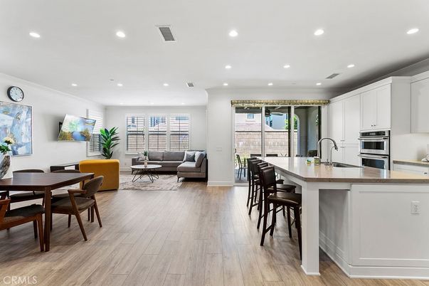 Dining room, Interior, Kitchen, Living room, Recessed Lighting, Stainless Steel Appliances, Wood Texture Flooring