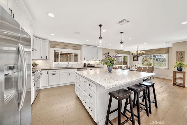 Chandelier, Dining room, Interior, Kitchen, Pendant Lights, Recessed Lighting, Stainless Steel Appliances, Wood Texture Flooring