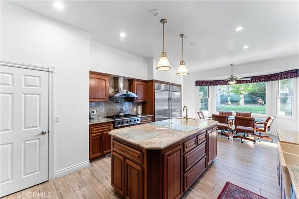 Dining room, Interior, Kitchen, Pendant Lights, Recessed Lighting, Stainless Steel Appliances, Wood Texture Flooring