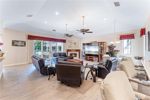 Chandelier, Dining room, Fireplace, Interior, Living room, Recessed Lighting, Wood Texture Flooring