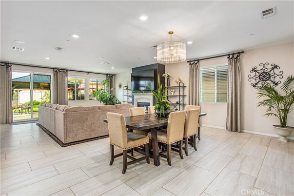 Chandelier, Dining room, Fireplace, Interior, Living room, Recessed Lighting, Wood Texture Flooring
