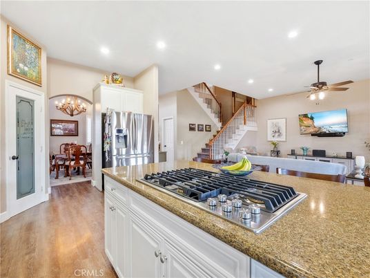 Chandelier, Dining room, Interior, Kitchen, Recessed Lighting, Stainless Steel Appliances, Wood Texture Flooring