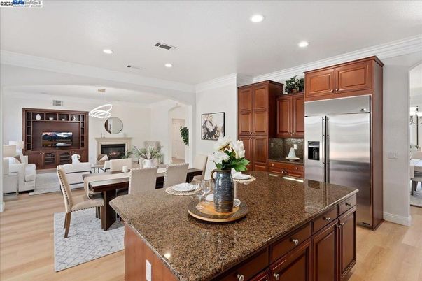 Dining room, Fireplace, Interior, Kitchen, Living room, Recessed Lighting, Stainless Steel Appliances, Wood Texture Flooring