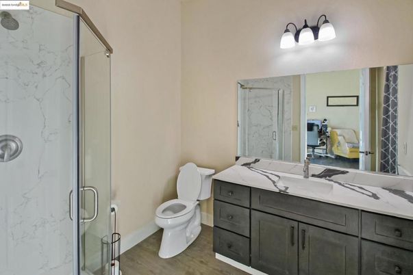 Bathroom, Glass Shower, Interior, Marble Walls, Wood Texture Flooring