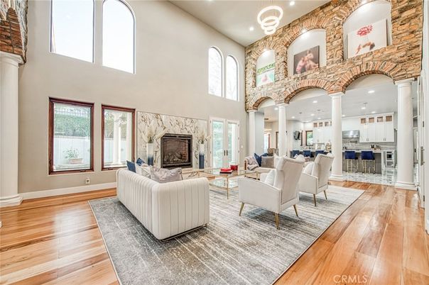 Dining room, Fireplace, Interior, Living room, Recessed Lighting, Stone Walls, Wood Texture Flooring