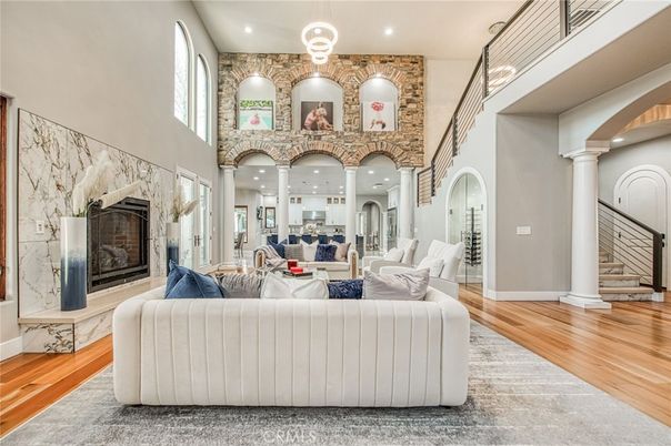 Fireplace, Interior, Living room, Recessed Lighting, Stone Walls, Wood Texture Flooring