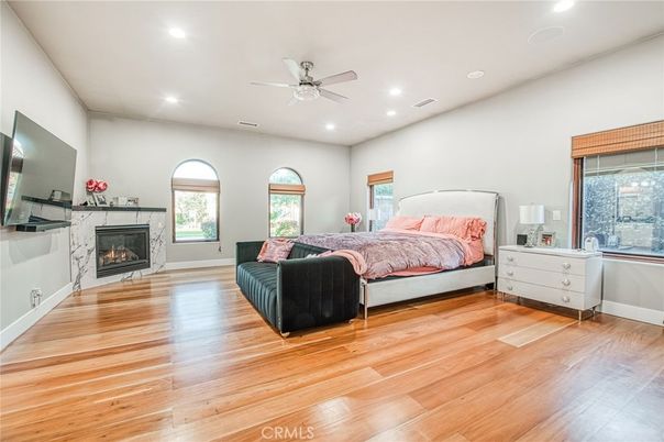 Bedroom, Fireplace, Interior, Recessed Lighting, Wood Texture Flooring