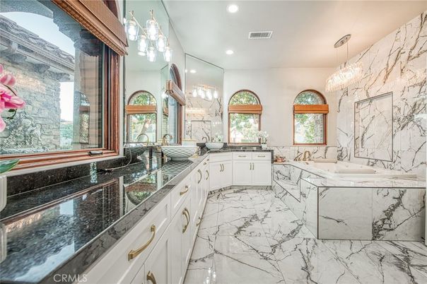 Bathroom, Chandelier, Dual Sink Vanities, Glass Shower, Interior, Marble, Marble Walls, Recessed Lighting