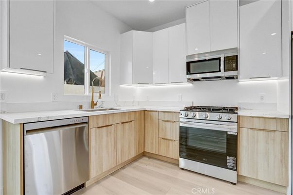 Interior, Kitchen, Recessed Lighting, Stainless Steel Appliances, Wood Texture Flooring