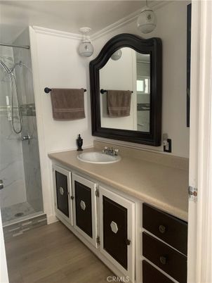 Bathroom, Dual Sink Vanities, Interior, Marble Walls, Wood Texture Flooring