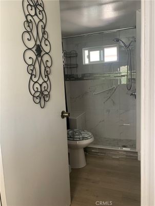 Bathroom, Glass Shower, Interior, Marble Walls, Wood Texture Flooring