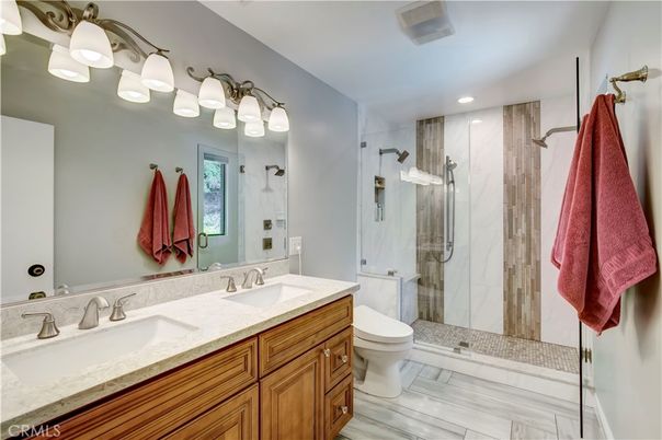 Bathroom, Dual Sink Vanities, Glass Shower, Interior, Recessed Lighting, Wood Texture Flooring