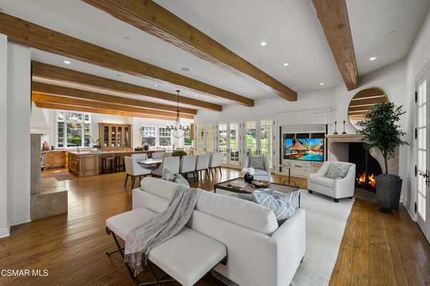 Chandelier, Dining room, Fireplace, Interior, Living room, Pendant Lights, Recessed Lighting, Wooden Beams, Wood Texture Flooring