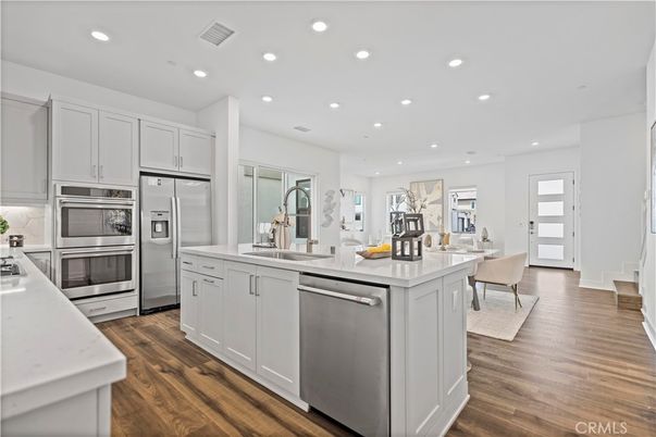Dining room, Interior, Kitchen, Recessed Lighting, Stainless Steel Appliances, Wood Texture Flooring