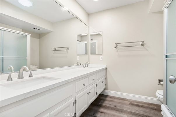 Bathroom, Dual Sink Vanities, Interior, Recessed Lighting, Wood Texture Flooring