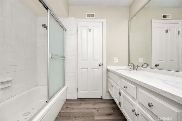 Bathroom, Dual Sink Vanities, Glass Shower, Interior, Wood Texture Flooring