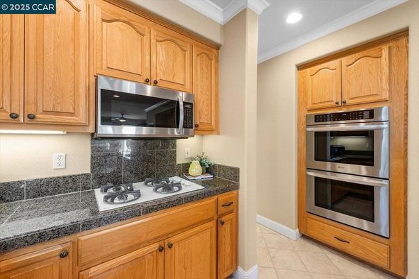 Interior, Kitchen, Recessed Lighting, Stainless Steel Appliances, Tile Countertops