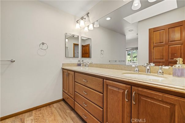 Bathroom, Dual Sink Vanities, Interior, Recessed Lighting, Wood Texture Flooring