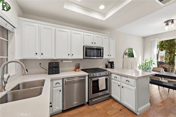 Dining room, Interior, Kitchen, Recessed Lighting, Stainless Steel Appliances, Wood Texture Flooring