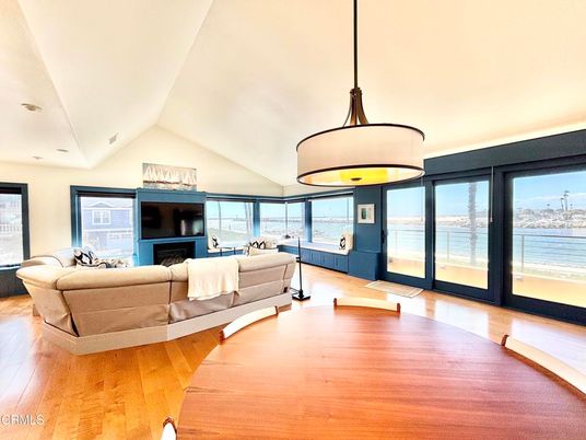Fireplace, Interior, Living room, Pendant Lights, Recessed Lighting, Water, Wood Texture Flooring