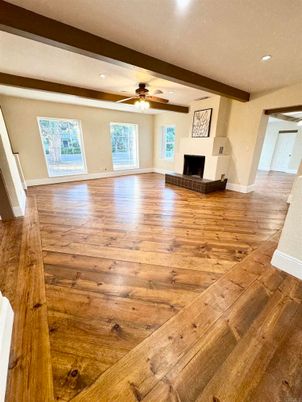 Empty room, Fireplace, Interior, Recessed Lighting, Wooden Beams, Wood Texture Flooring