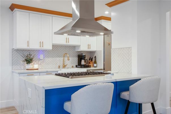 Interior, Kitchen, Marble Walls, Recessed Lighting, Stainless Steel Appliances, Wood Texture Flooring