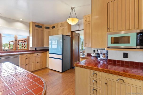 Interior, Kitchen, Pendant Lights, Recessed Lighting, Stainless Steel Appliances, Tile Countertops, Wood Texture Flooring