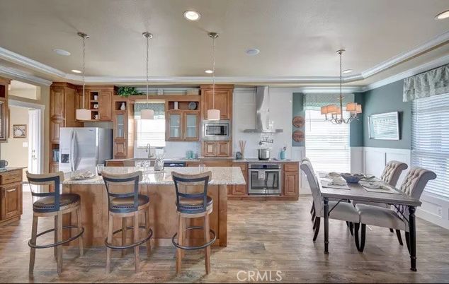 Chandelier, Dining room, Interior, Kitchen, Pendant Lights, Recessed Lighting, Stainless Steel Appliances, Wood Texture Flooring