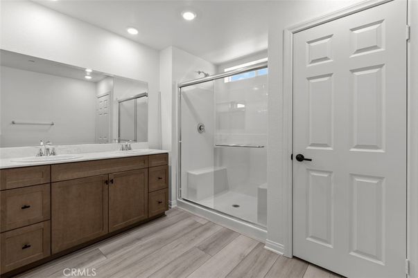 Bathroom, Dual Sink Vanities, Glass Shower, Interior, Recessed Lighting, Wood Texture Flooring