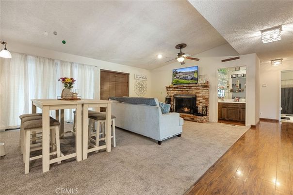 Dining room, Fireplace, Interior, Living room, Pendant Lights, Recessed Lighting, Wood Texture Flooring