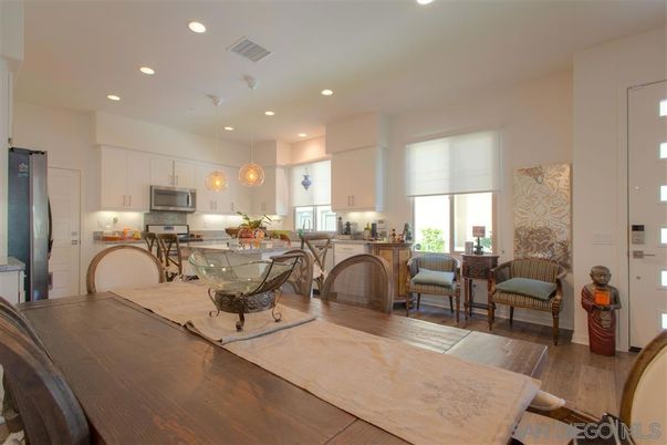 Dining room, Interior, Kitchen, Pendant Lights, Recessed Lighting, Stainless Steel Appliances, Wood Texture Flooring