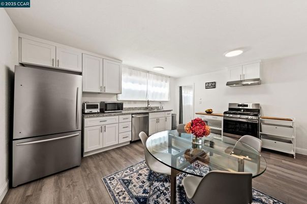 Dining room, Interior, Kitchen, Recessed Lighting, Stainless Steel Appliances, Wood Texture Flooring