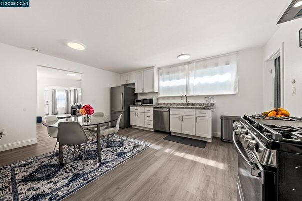 Dining room, Interior, Kitchen, Recessed Lighting, Stainless Steel Appliances, Wood Texture Flooring