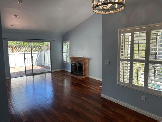 Chandelier, Empty room, Fireplace, Interior, Recessed Lighting, Wood Texture Flooring
