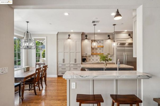 Dining room, Interior, Kitchen, Pendant Lights, Recessed Lighting, Stainless Steel Appliances, Wood Texture Flooring