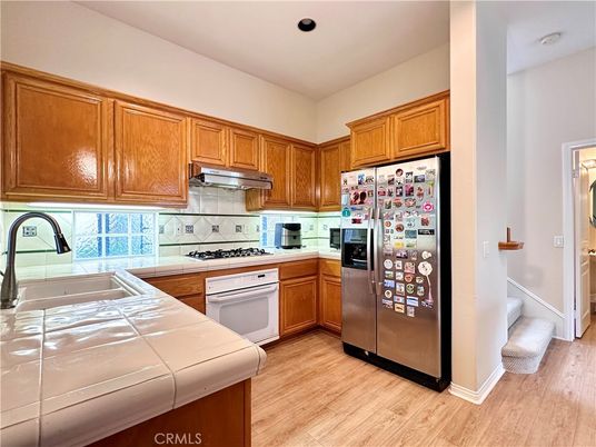 Interior, Kitchen, Recessed Lighting, Tile Countertops, Wood Texture Flooring