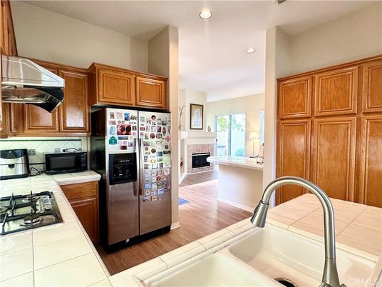 Fireplace, Interior, Kitchen, Recessed Lighting, Tile Countertops, Wood Texture Flooring