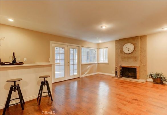 Empty room, Fireplace, Interior, Recessed Lighting, Stone Walls, Wood Texture Flooring