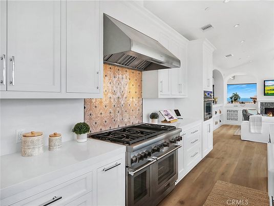 Fireplace, Interior, Kitchen, Recessed Lighting, Stainless Steel Appliances, Water, Wood Texture Flooring