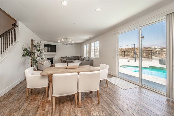 Chandelier, Dining room, Fireplace, Interior, Living room, Recessed Lighting, Wood Texture Flooring
