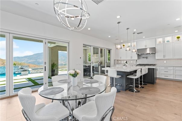 Dining room, Interior, Kitchen, Pendant Lights, Recessed Lighting, Stainless Steel Appliances, Water, Wood Texture Flooring