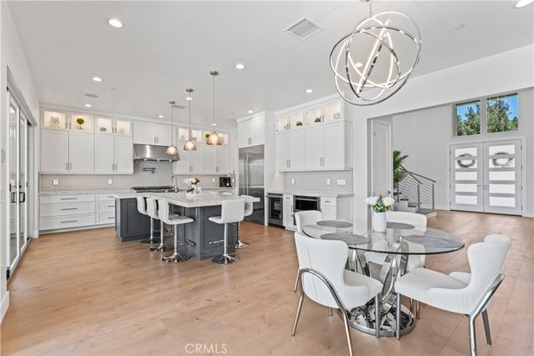 Dining room, Interior, Kitchen, Pendant Lights, Recessed Lighting, Stainless Steel Appliances, Wood Texture Flooring