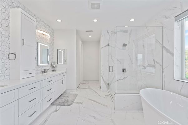 Bathroom, Dual Sink Vanities, Free Standing Baths, Glass Shower, Interior, Marble, Marble Walls, Recessed Lighting