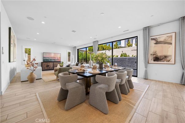 Dining room, Fireplace, Interior, Living room, Recessed Lighting, Wood Texture Flooring
