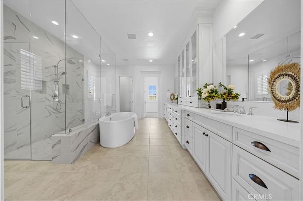 Bathroom, Dual Sink Vanities, Free Standing Baths, Glass Shower, Interior, Marble Walls, Recessed Lighting