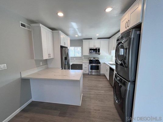 Interior, Kitchen, Recessed Lighting, Stainless Steel Appliances, Washer, Wood Texture Flooring