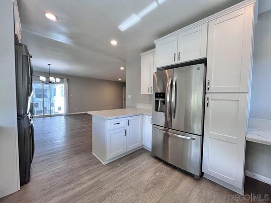 Chandelier, Interior, Kitchen, Recessed Lighting, Stainless Steel Appliances, Wood Texture Flooring