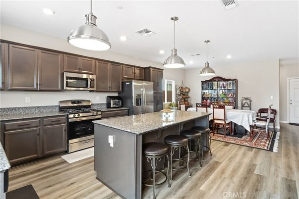 Dining room, Interior, Kitchen, Pendant Lights, Recessed Lighting, Stainless Steel Appliances, Wood Texture Flooring