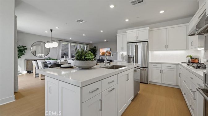 Dining room, Interior, Kitchen, Pendant Lights, Recessed Lighting, Stainless Steel Appliances, Wood Texture Flooring