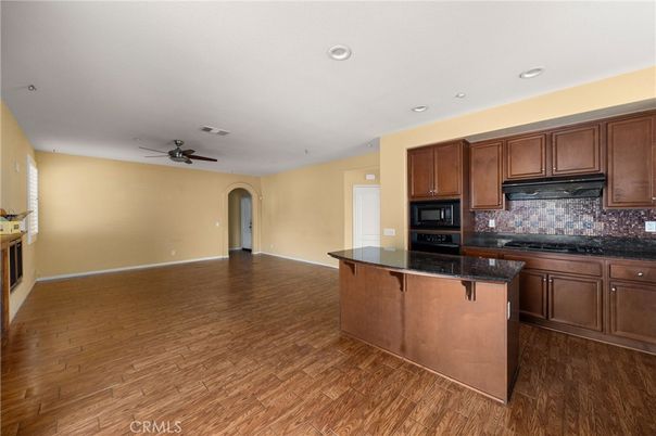 Empty room, Fireplace, Interior, Kitchen, Recessed Lighting, Wood Texture Flooring